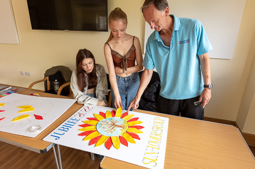 Chloe helping to make the Sunflower Logo Artwork