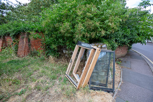 window frames dumped in car park